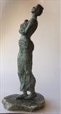 Walking woman by Janis Ridley, Sculpture, Bronze